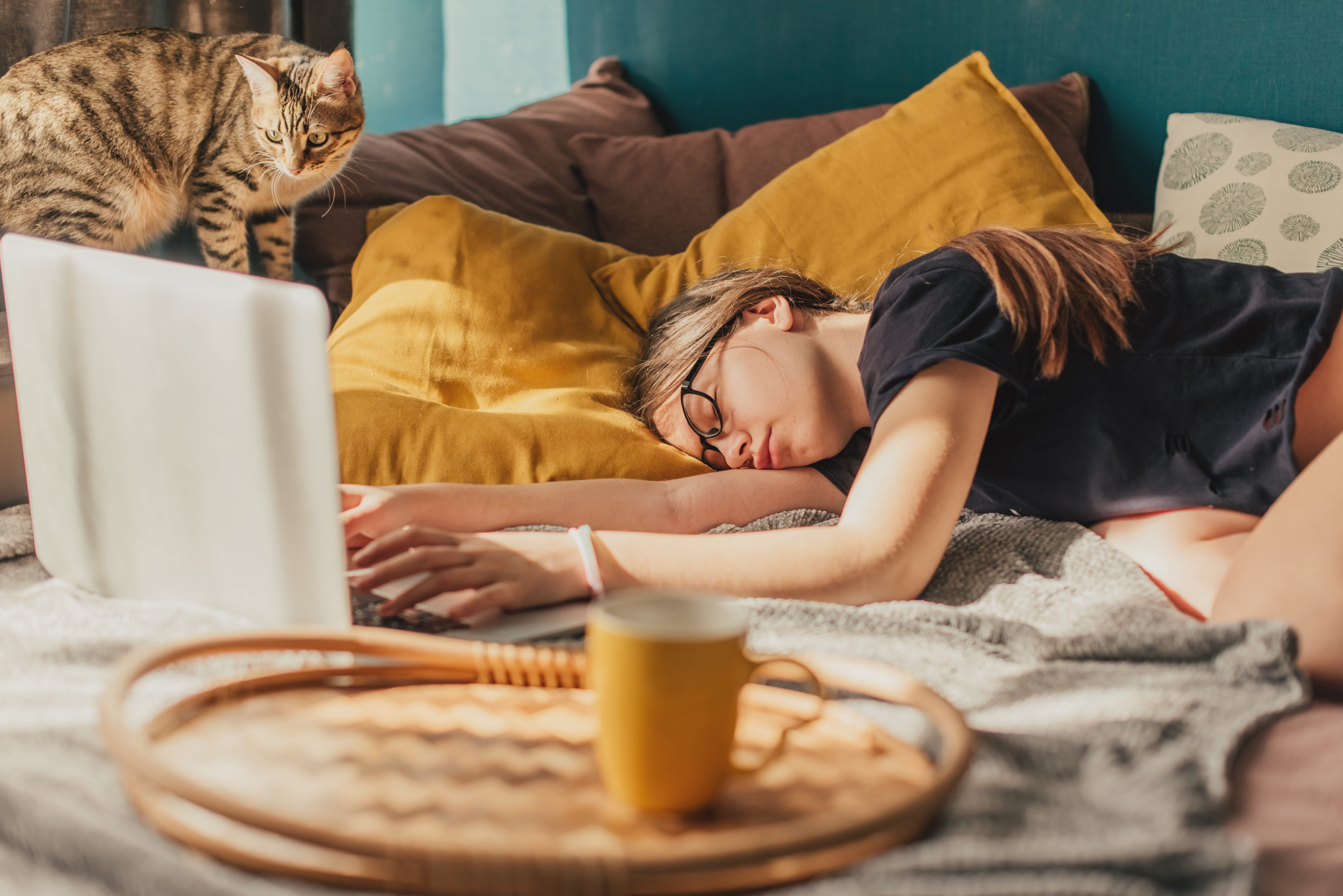 Teen asleep at laptop