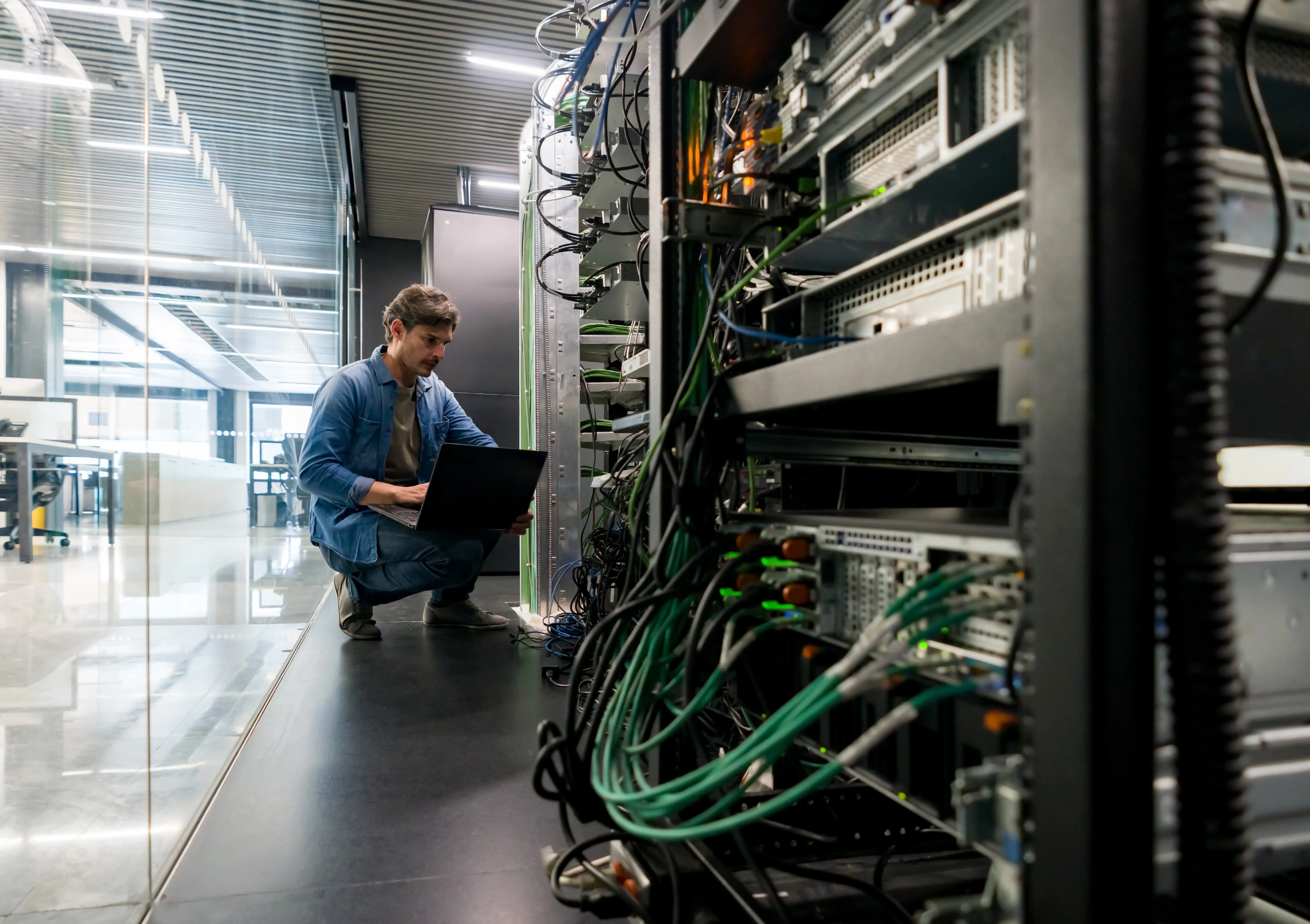 Computer technician fixing a network server at the office 