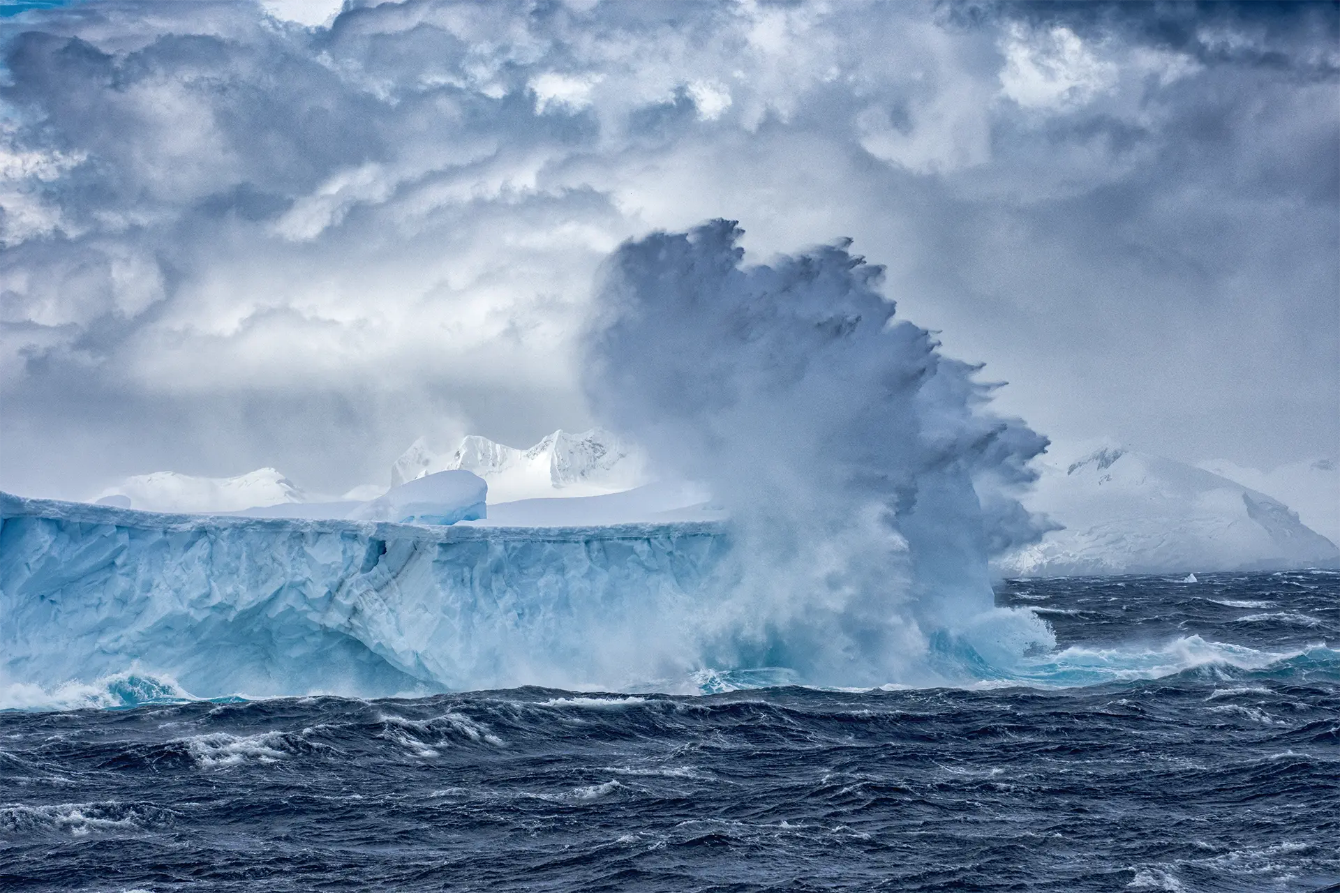 Waves crashing against an iceberg
