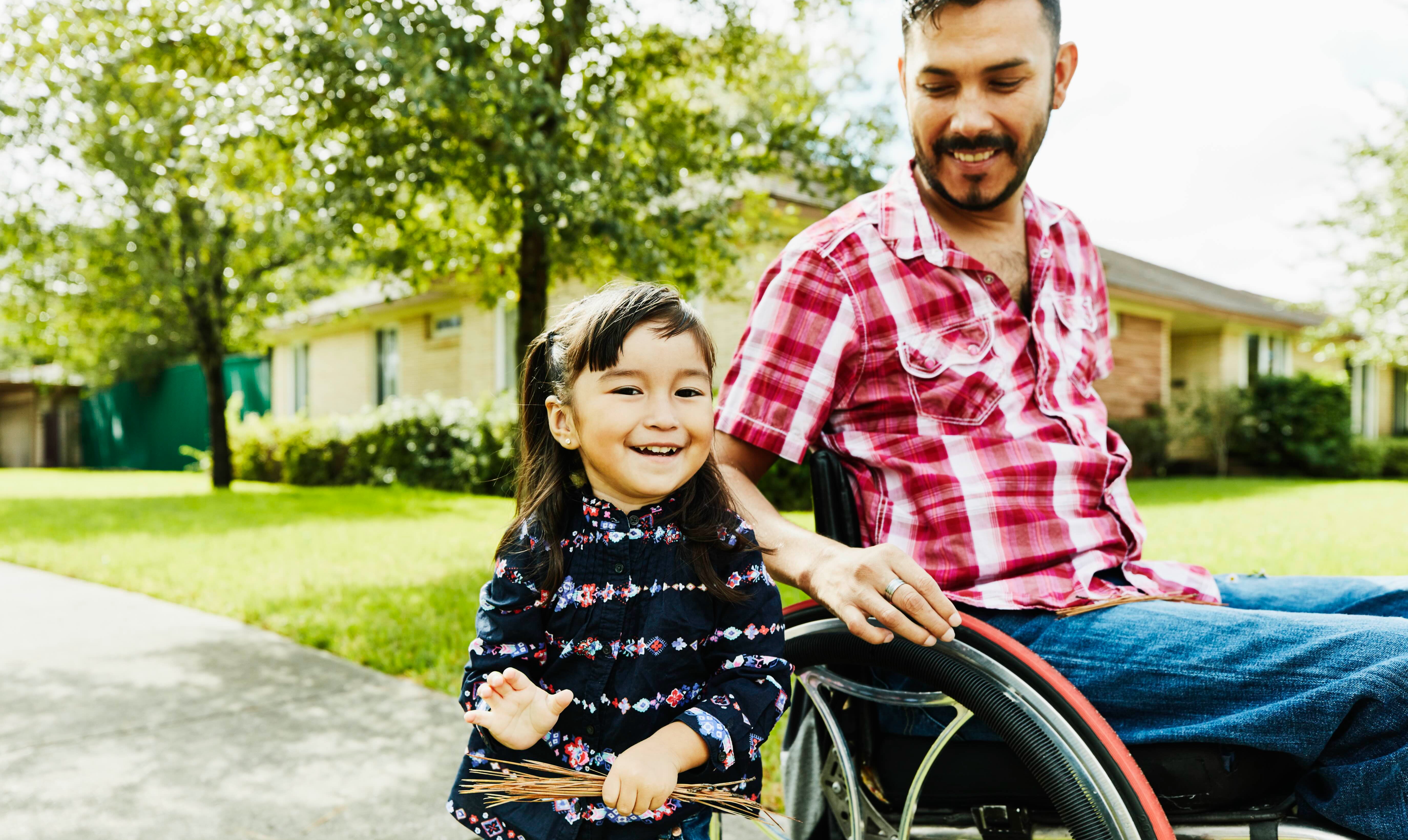 Father in wheelchair with daughter