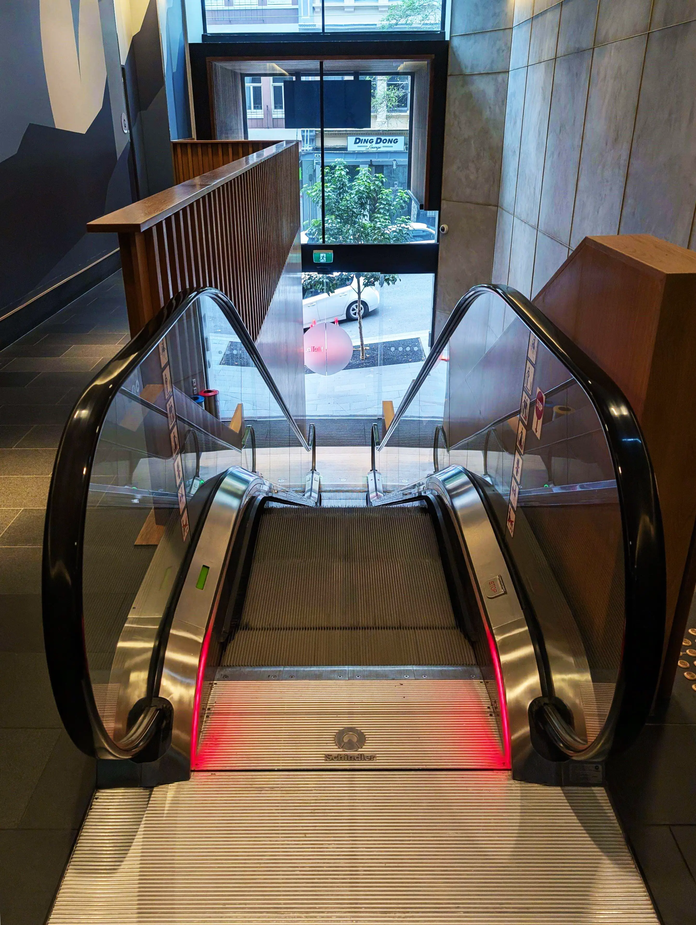 The escalator in the hotel, there are no high contrast lines at the edge of the tread or when entering the escalator.
