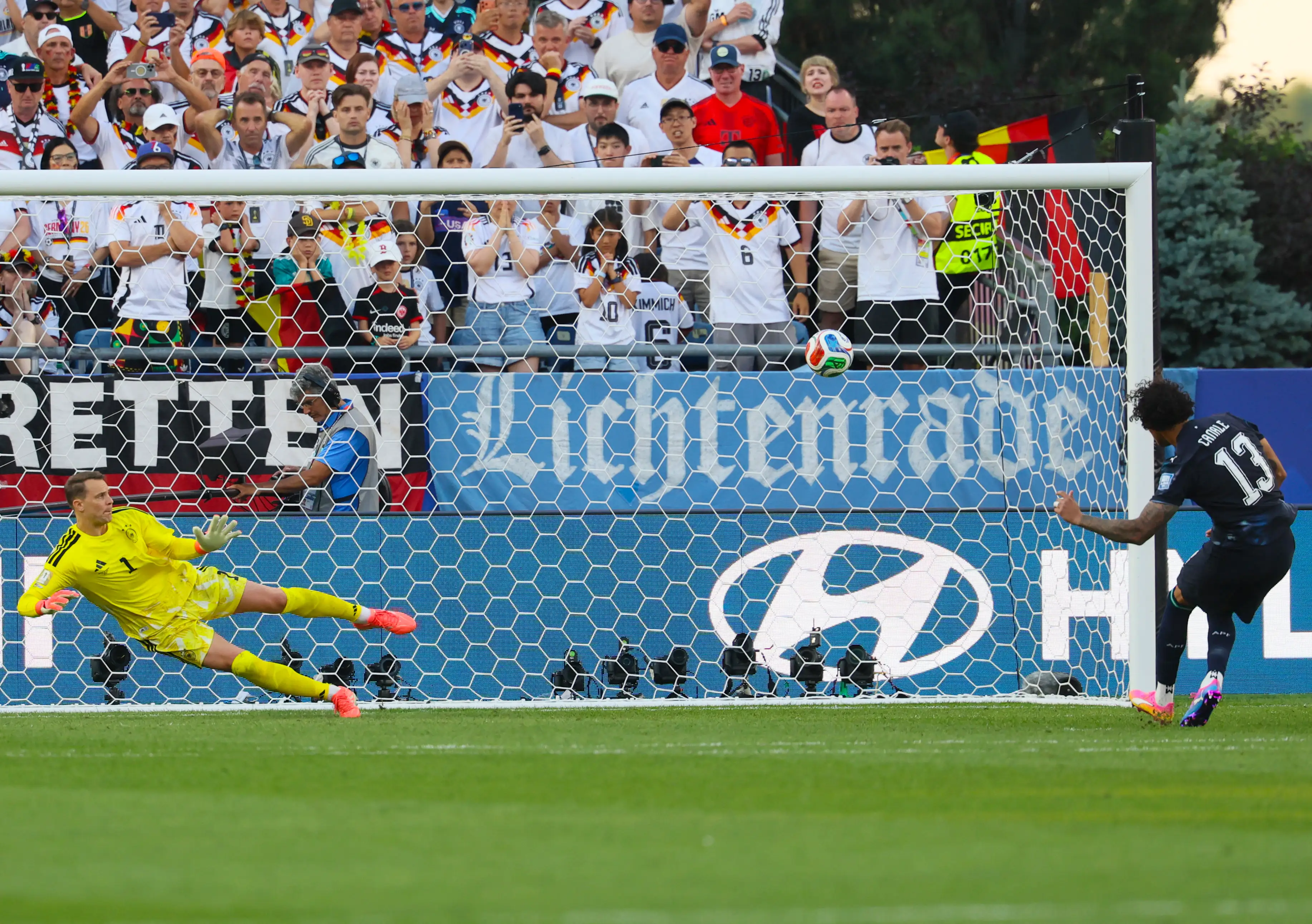 Jose Canale scores a penalty kick past Germany's goalkeeper Manuel Neuer to win the penalty shootout