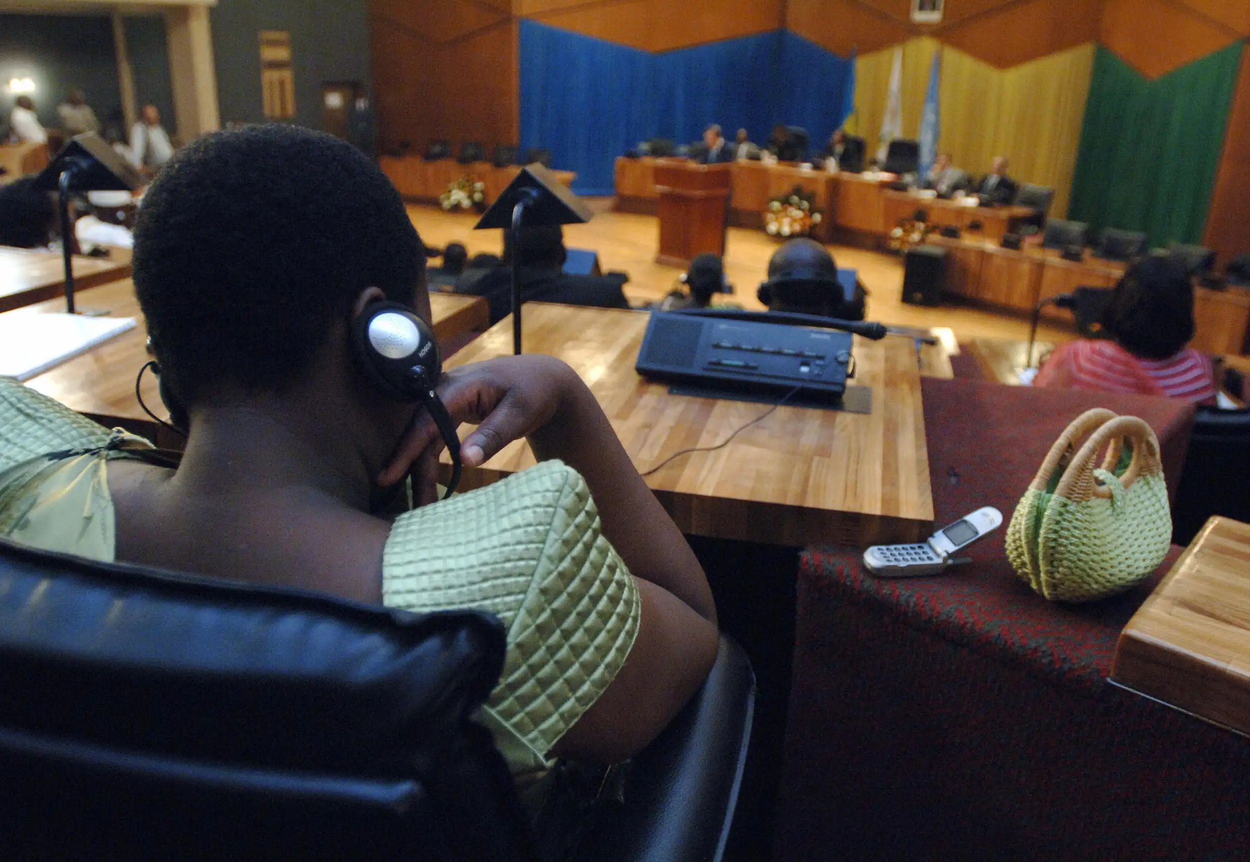 A member of parliament listens to at the Rwandan Parliament building.