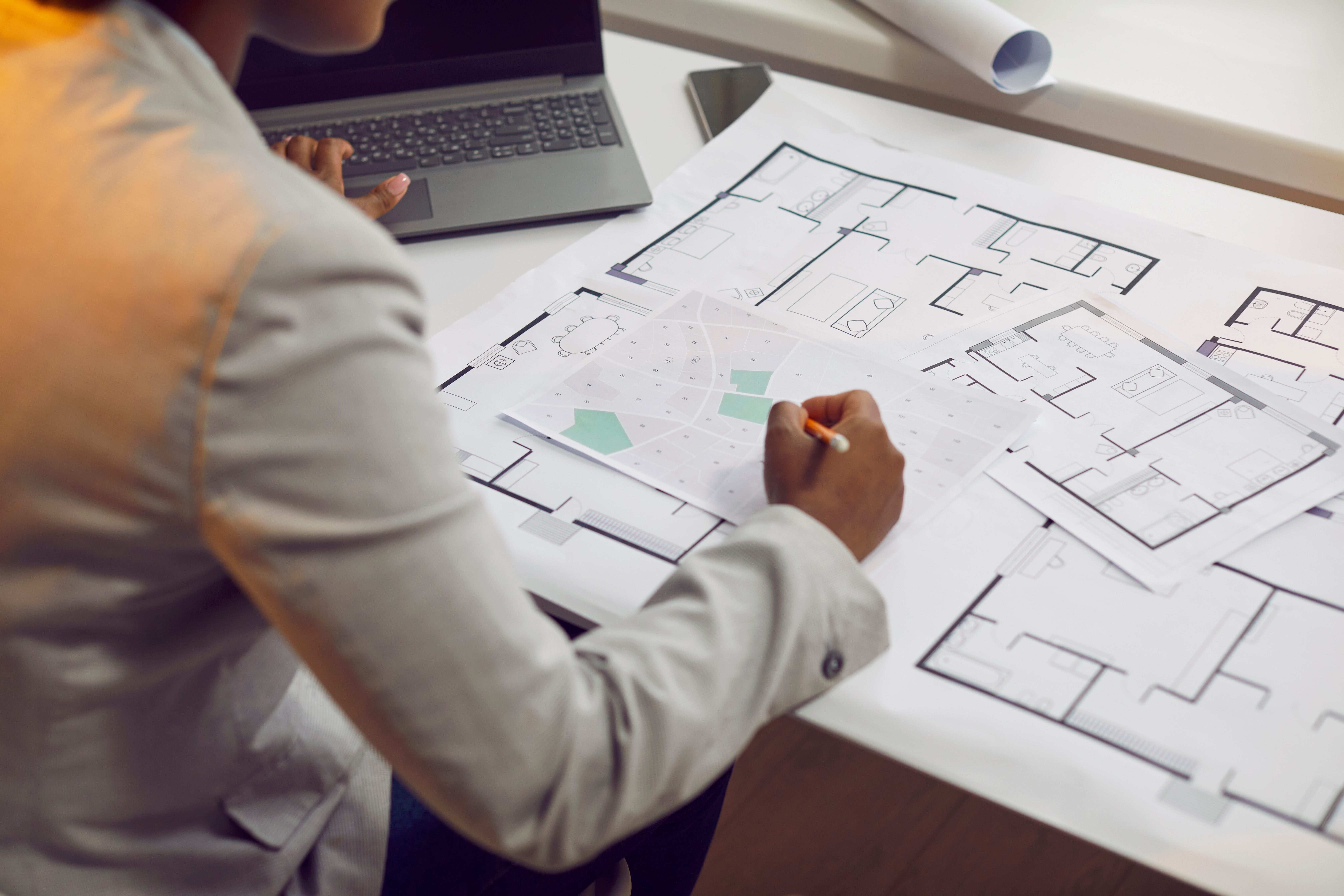 Designer with house plans