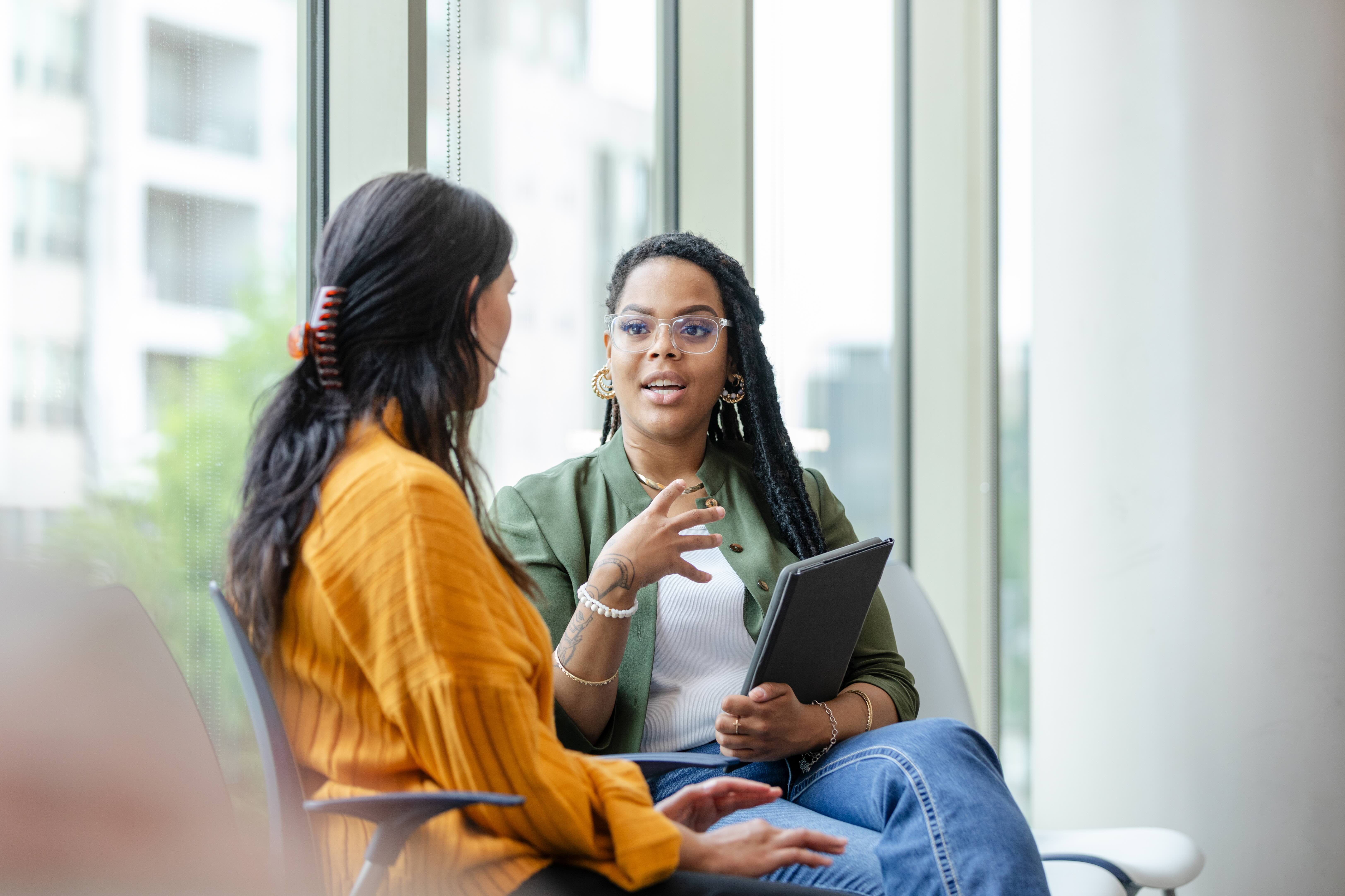 Two Women Talking Expressively