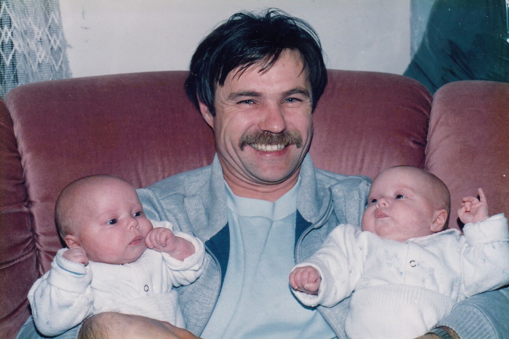 Baby twin girls with their Dad