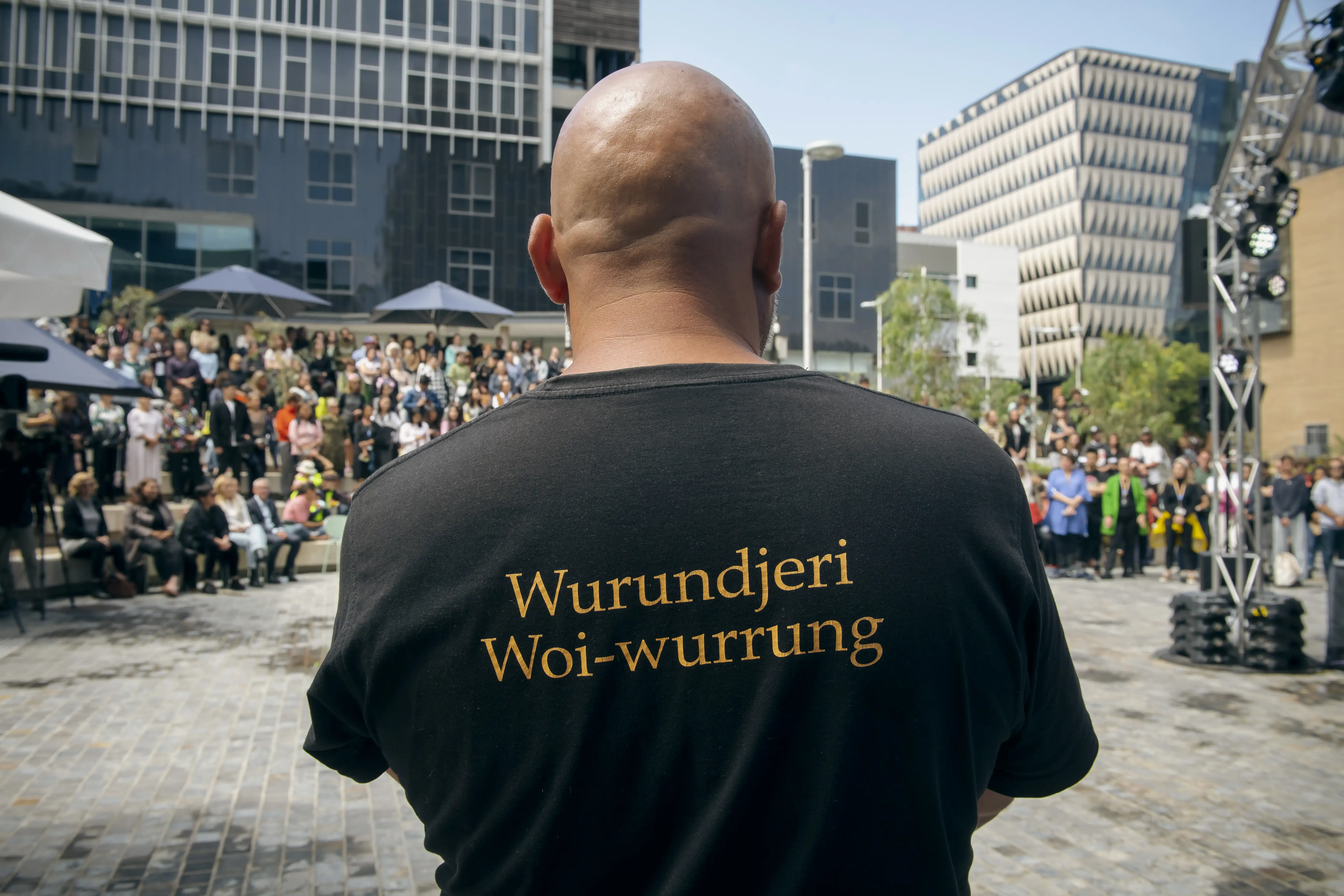 Wominjeka 2023 Student Precinct with an Indigenous man wearing a Wurundjeri Woi-wurrung shirt.