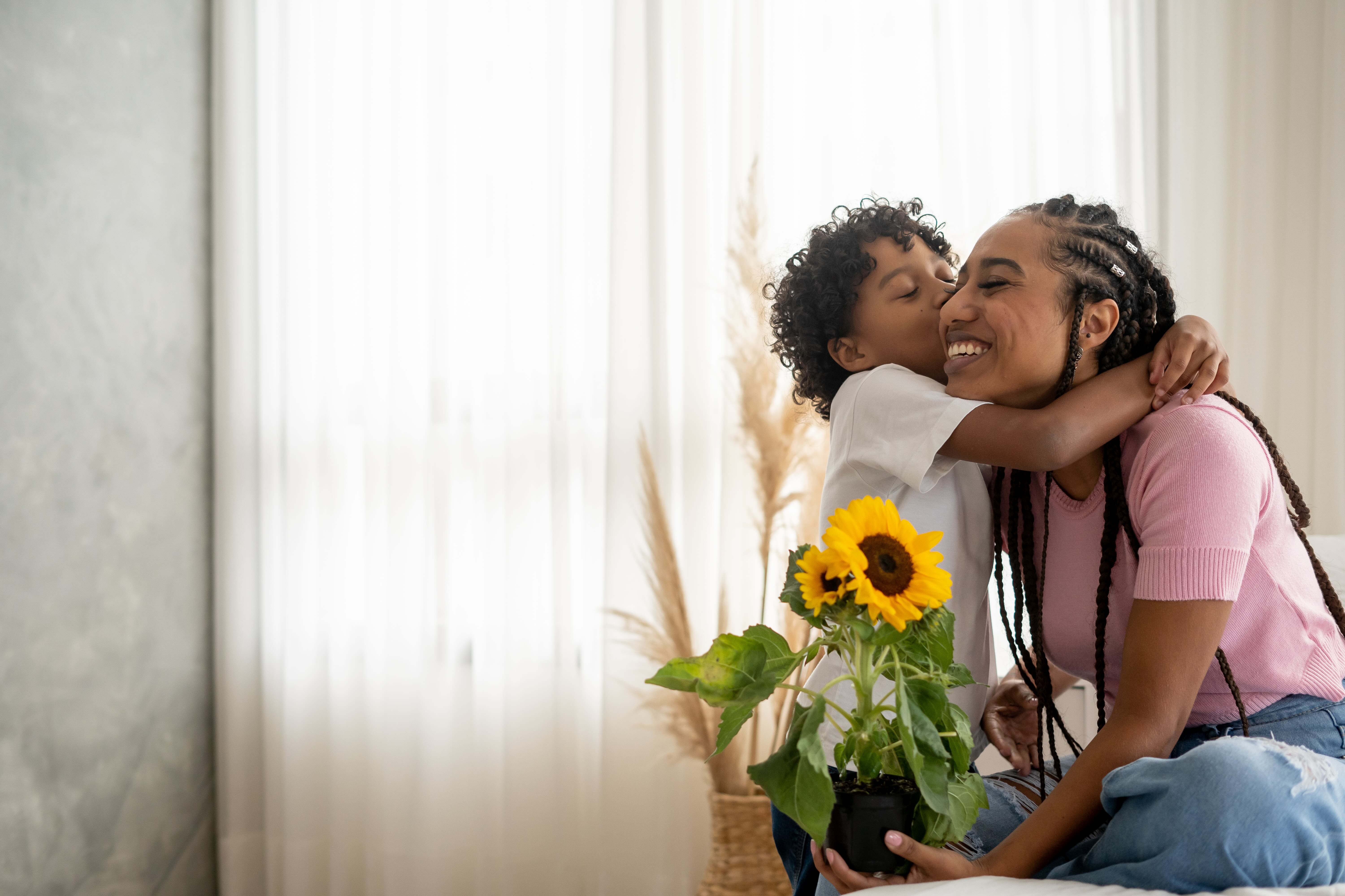Mother and son with sunflowe