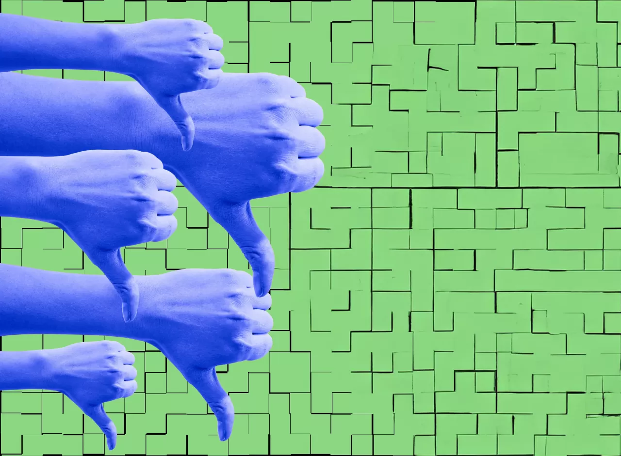 Photos of hands giving a 'thumbs down' against a green wall