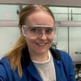 Headshot of Laura Burchill in laboratory clothes