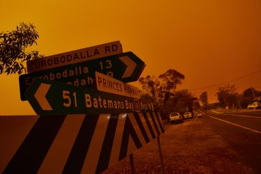 Roadsigns in bushfire smoke