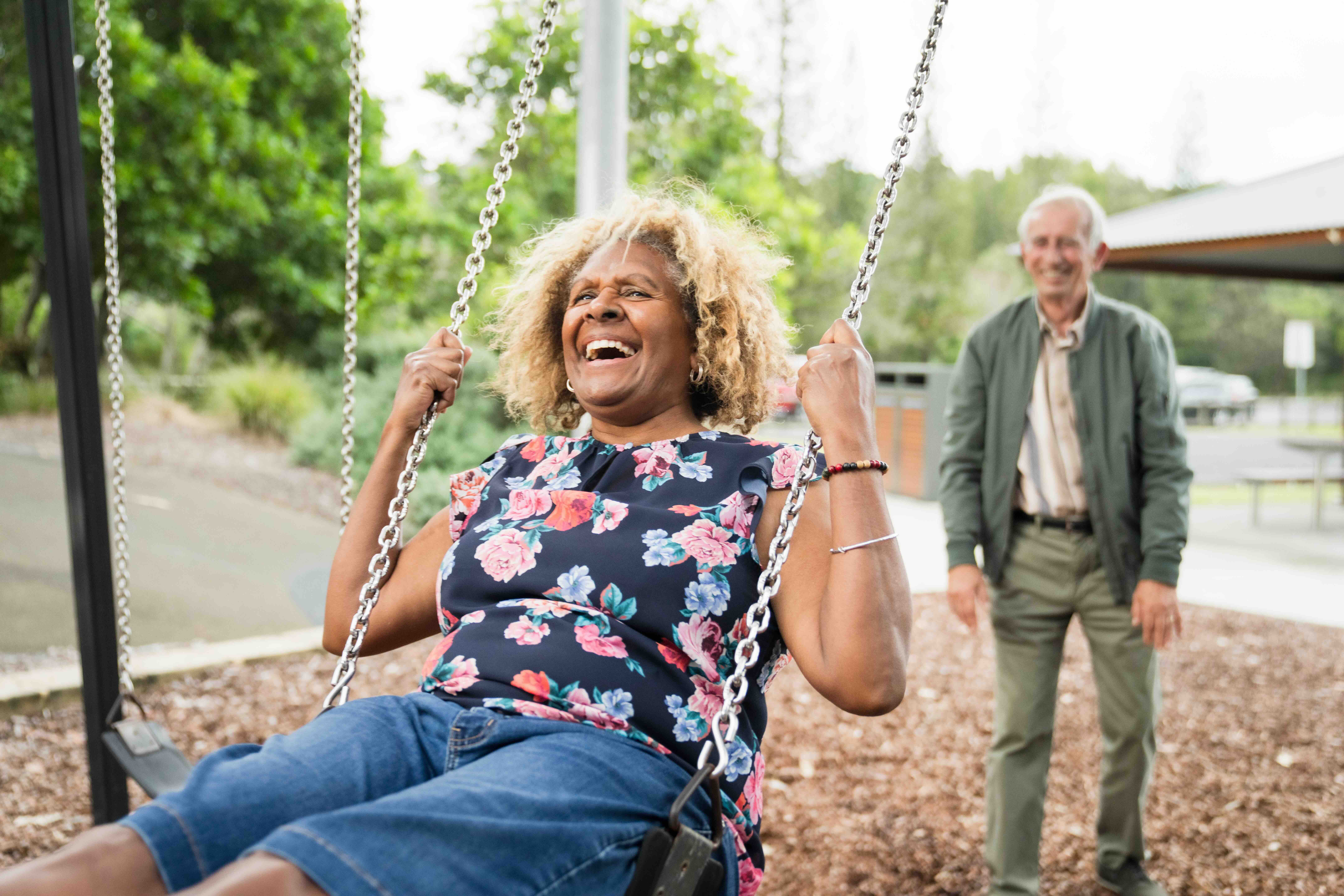 Seniors on swings in park