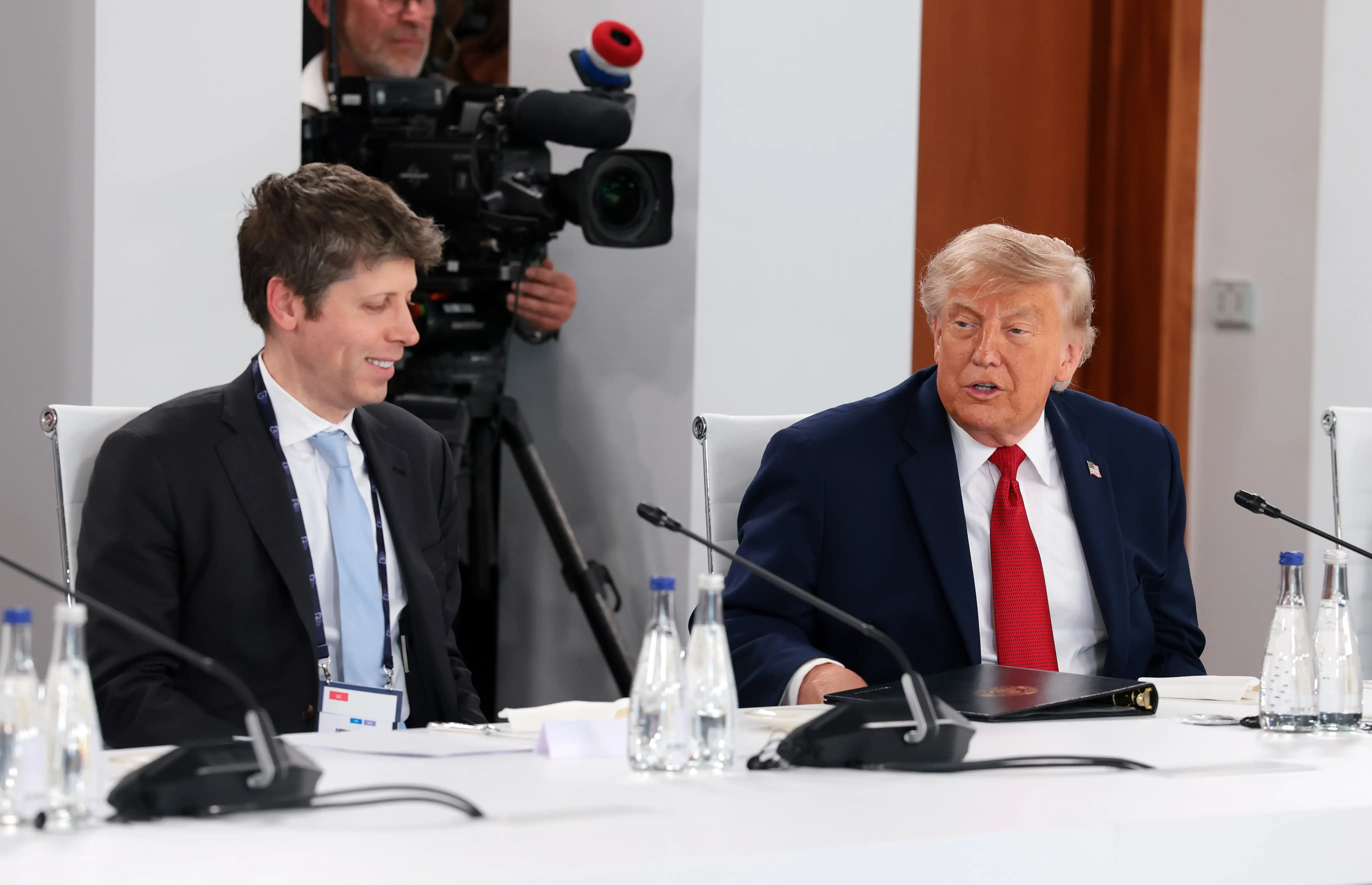 CEO of OpenAI Sam Altman (L) and U.S. President Donald Trump attend a working lunch